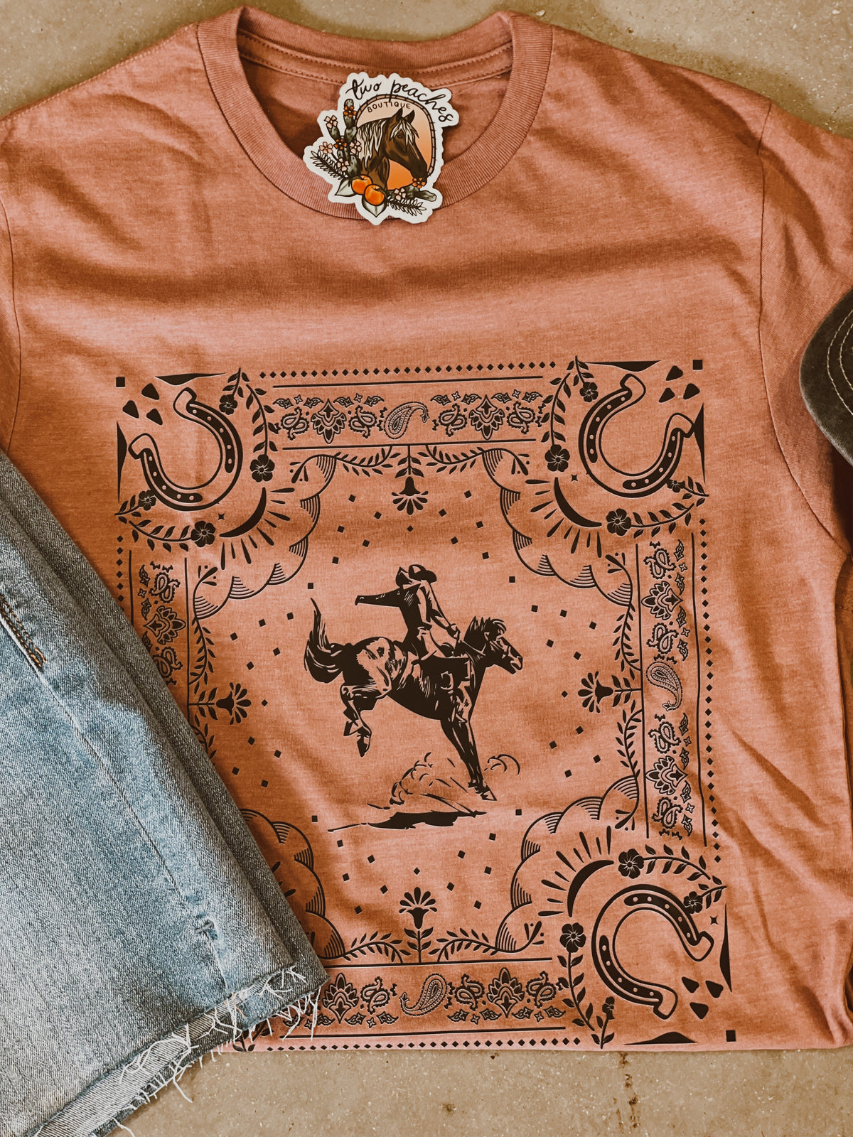 Salmon buckin bronco tee